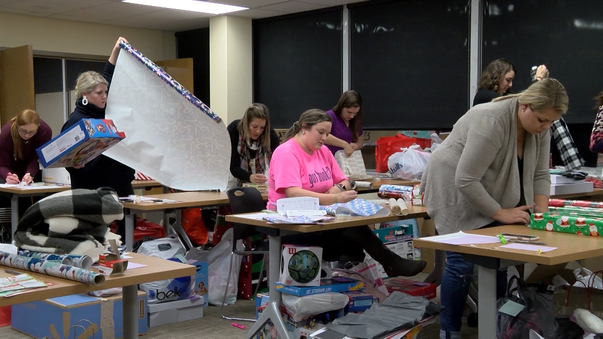 People wrapping presents