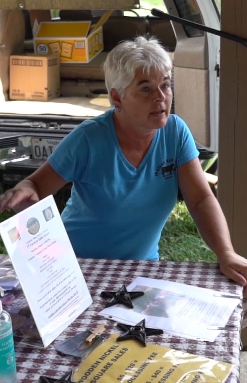 Catawba Farmers Market Vendor interacting with customers.